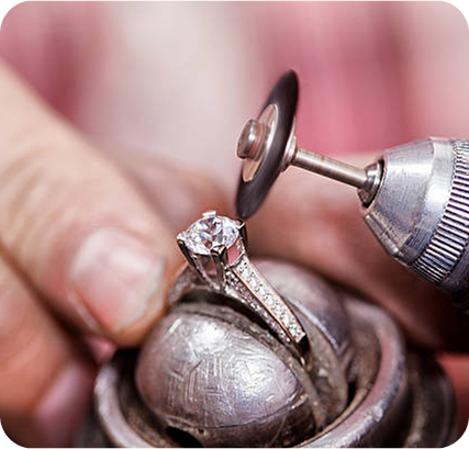 Artisan polishing a jewellery piece to a high shine