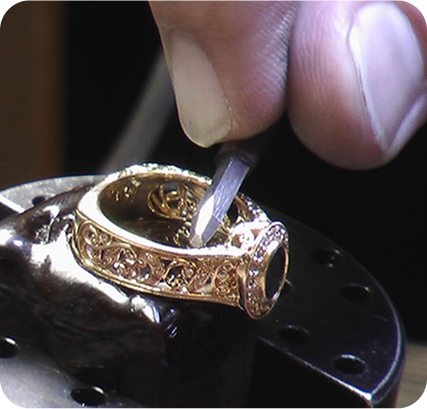 Jeweller engraving a personalised message onto a piece
